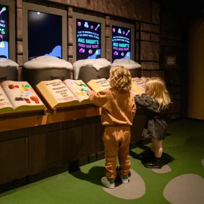 Children playing with The Burrow Recipe Books